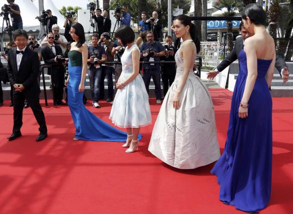 Director Hirokazu Koreeda, cast members Masami Nagasawa, Suzu Hirose, Haruka Ayase and Kaho arrive for the screening of the film "Our Little Sister" during the 68th Cannes Film Festival in Cannes
