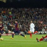 Barcelona's Messi scores a goal against Sevilla's goalkeeper Beto during their Spanish first division soccer match at Camp Nou stadium in Barcelona