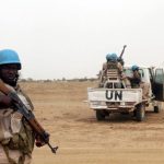 UN peacekeepers stand guard in the northern town of Kouroume