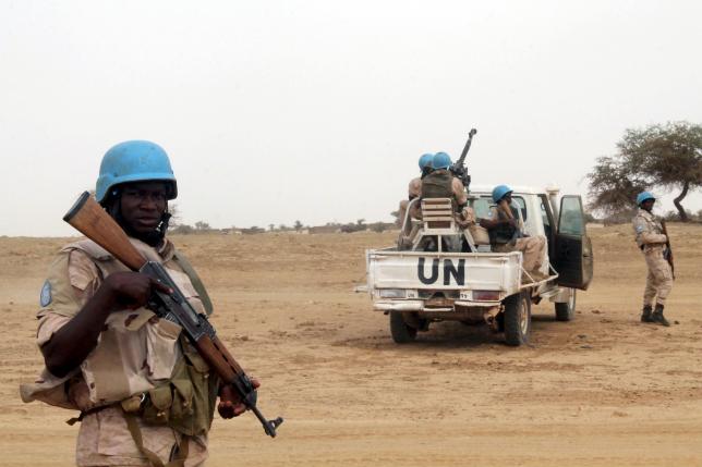 UN peacekeepers stand guard in the northern town of Kouroume