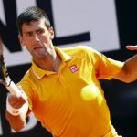 Djokovic of Serbia returns the ball to Almagro of Spain during their match at the Rome Open tennis tournament in Rome