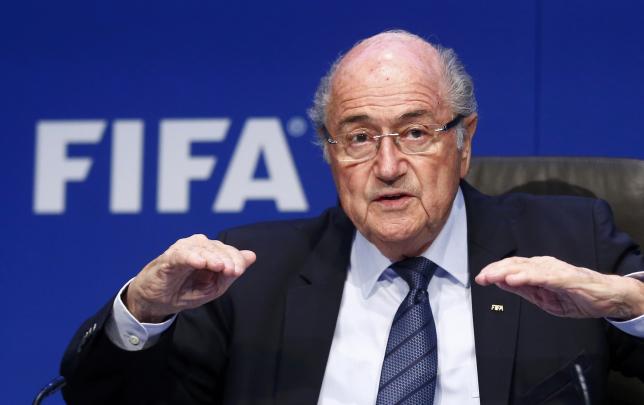 Re-elected FIFA President Blatter gestures during a news conference after an extraordinary Executive Committee meeting in Zurich