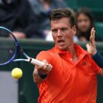 Tomas Berdych of the Czech Republic plays a shot to Yoshihito Nishioka of Japan during their men's singles match at the French Open tennis tournament at the Roland Garros stadium in Paris