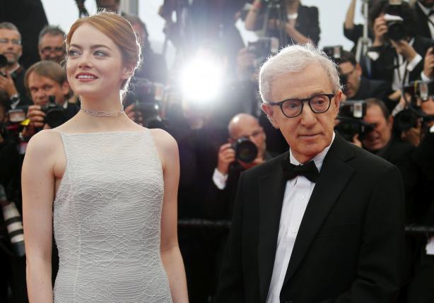 Director Woody Allen and cast member Emma Stone pose on the red carpet as tey arrive for the screening of the film "Irrational Man" out of competition at the 68th Cannes Film Festival in Cannes