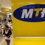 A customer leaves an MTN shop in Johannesburg