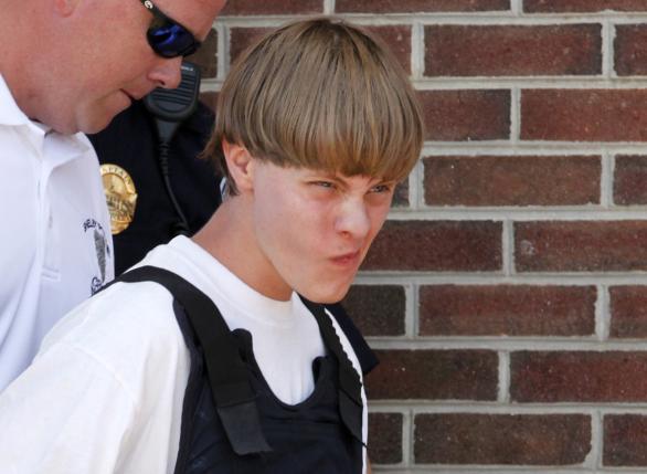 Police lead suspected shooter Dylann Roof into the courthouse in Shelby, North Carolina