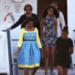 First Lady Michelle Obama, Malia Obama (C), Sasha Obama (R) and her mother Marian Robinson
