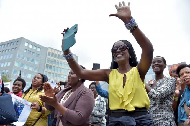Singer Khadja Nin (R) takes part in a protest against Burundi President Pierre Nkurunziza and his bid for a third term, in Brussels, Belgium