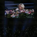 Singer Lady Gaga is displayed on a videowall while fans light their phones during the opening ceremony of the 1st European Games in Baku