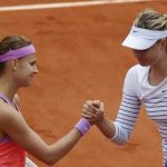 Lucie Safarova of the Czech Republic shakes hands with Maria Sharapova of Russia after winning their women's singles match during the French Open tennis tournament at the Roland Garros stadium in Paris