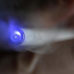 A man uses an E-cigarette in this illustration picture taken in Paris