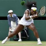 Serena Williams of the U.S.A. hits a shot during her match against Venus Williams of the U.S.A. at the Wimbledon Tennis Championships in London