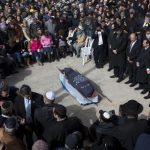 Family and friends of Israeli Dafna Meir attend her funeral in a cemetery in Jerusalem