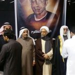 Sheikh Hassan al-Saffar, a top Shiite cleric from Qatif, center