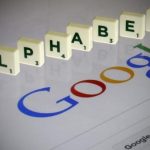 Letters spell the word "Alphabet" as they are seen on a computer screen with a Google search page in this photo illustration taken in Paris