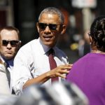 U.S. President Barack Obama arrives at a restaurant to meet with formerly incarcerated individuals who have previously received commutations from his and previous administrations in Washington