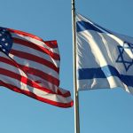 two flags: American and Israeli waving in the blue sky