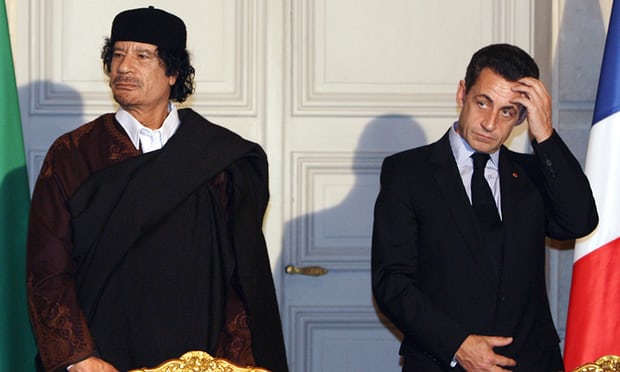 Nicolas Sarkozy and the former Libyan leader Muammar Gaddafi 