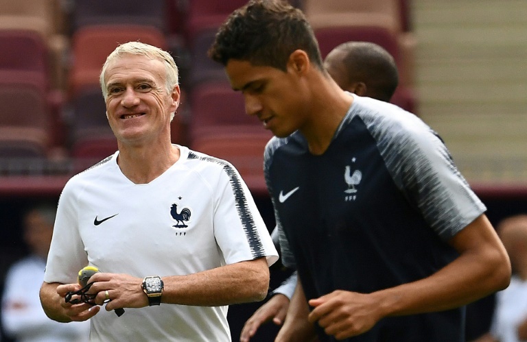 Raphael Varane (R) is likely to captain France as Didier Deschamps (L) rotates his squad for the Denmark game