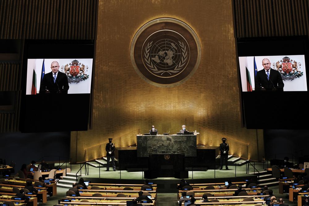 Bulgaria's President Rumen Radev is seen on video screens as he addresses the 76th Session of the United Nations General Assembly 