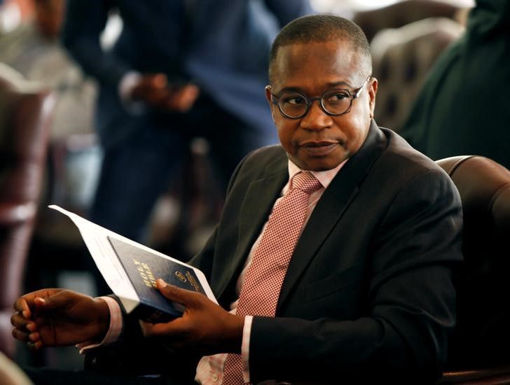 Zimbabwean Finance Minister Mthuli Ncube looks on before the swearing in of new cabinet ministers at State House in Harare, Zimbabwe, September 10, 2018. REUTERS/Philimon Bulawayo
