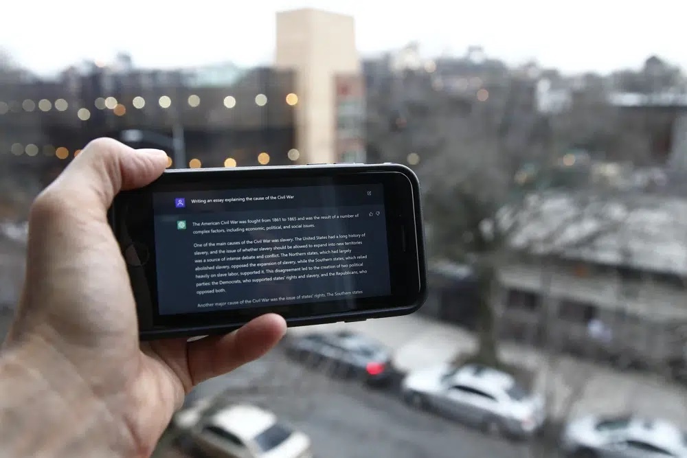 A ChatGPT prompt is shown on a device near a public school in Brooklyn, New York, Thursday, Jan. 5, 2023. New York City school officials started blocking this week the impressive but controversial writing tool that can generate paragraphs of human-like text. (AP Photo/Peter Morgan)