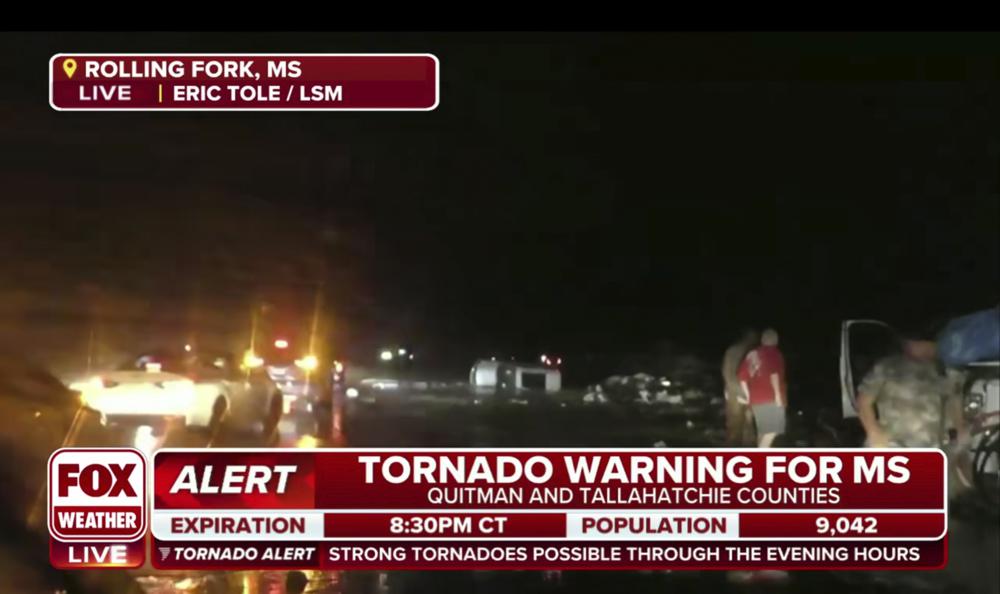 This screen grab from video broadcast by Fox Weather shows the immediate aftermath of severe weather in Rolling Fork, Miss., late Friday, March 24, 2023. (Fox Weather via AP)