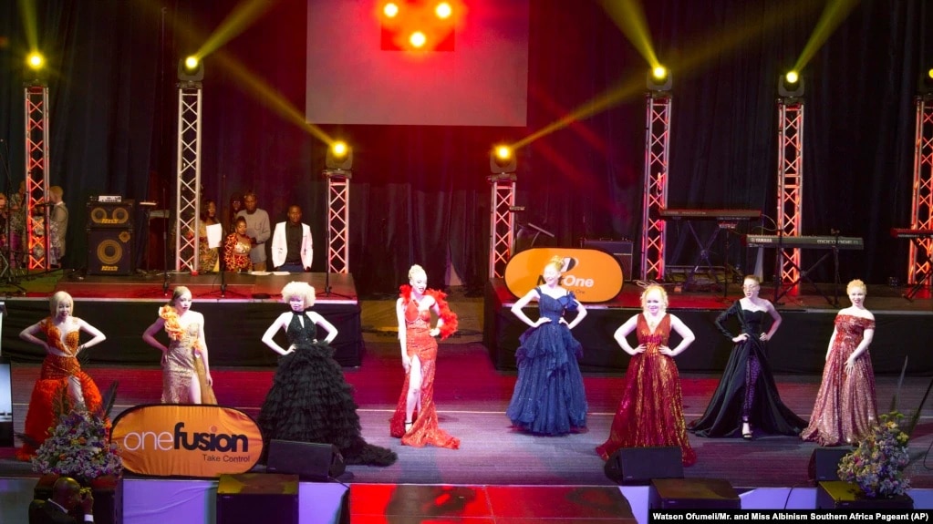 In this photo supplied by pageant organizer John Karimazonde, contestants compete in the Mr. and Miss Albinism Southern Africa Pageant at the Harare International Conference Centre, Oct. 14, 2023.