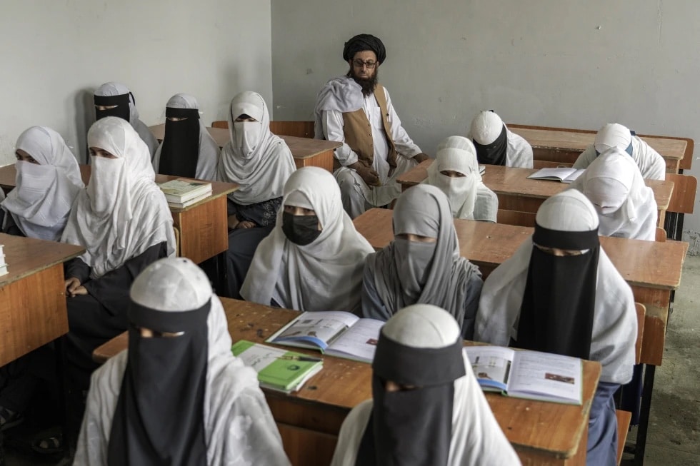 Afghan girls attend a religious school, which remained open since the last year’s Taliban takeover, in Kabul, Afghanistan