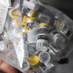 Vials of single doses of the Jynneos vaccine for monkeypox are seen from a cooler at a vaccinations site on Aug. 29, 2022, in the Brooklyn borough of New York. As Congo copes with its biggest outbreak of mpox, scientists warn discrimination against gay and bisexual men on the continent could make it worse. (AP Photo/Jeenah Moon, File)