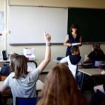 Schoolchildren work in a classroom on the first day of the new school year after summer break in Savenay, France, September 4, 2023. REUTERS/Stephane Mahe/files