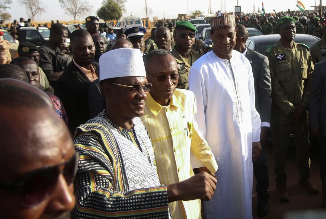 Prime Minister of Niger, Ali Mahamane Lamine Zeine, Prime Minister of Burkina Faso Apollinaire Joachim Kyelem de Tambela and Prime Minister of Mali Choguel Kokalla Maiga walk as they attend a sit-in in Niamey, Niger, December 29, 2023.