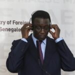 Senegal’s Foreign Affairs minister Amadou Ba attends a press conference at the Presidential Palace, in Dakar, Senegal, Sunday, Feb. 16, 2020.