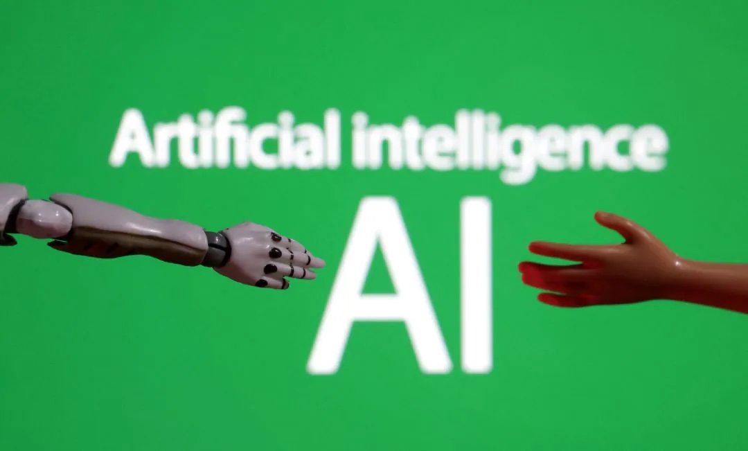 Words reading "Artificial intelligence AI", miniature of robot and toy hand are pictured in this illustration taken December 14, 2023. REUTERS/Dado Ruvic/Illustration/File Photo