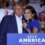 FILE - Arizona Republican gubernatorial candidate Kari Lake, right, speaks as former President Donald Trump listens during a rally, Oct. 9, 2022