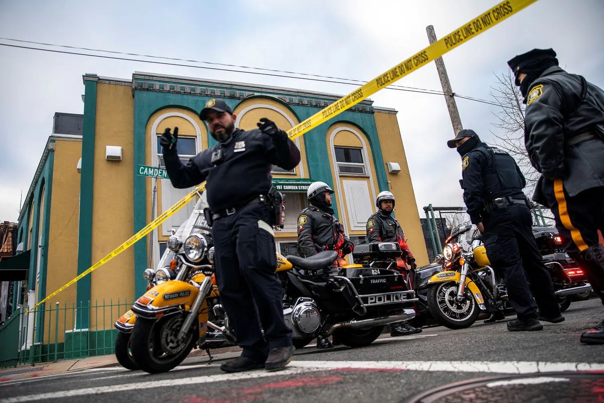 Newark Police Officers stand guard outside the Masjid Muhammad-Newark mosque following the shooting of Imam Hassan Sharif in Newark, New Jersey, U.S., January 3, 2024. REUTERS/Eduardo Munoz