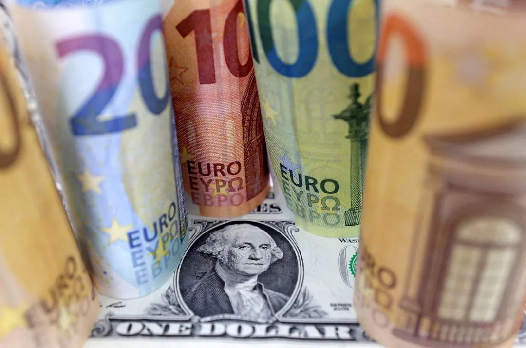 U.S. Dollar and Euro banknotes are seen in this illustration taken July 17, 2022. REUTERS/Dado Ruvic/Illustration/File Photo
