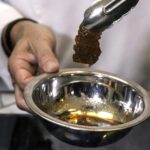 chef Amir Ilan prepares a lab-grown steak during a presentation by the company Aleph Farms, in Jaffa, Israel.