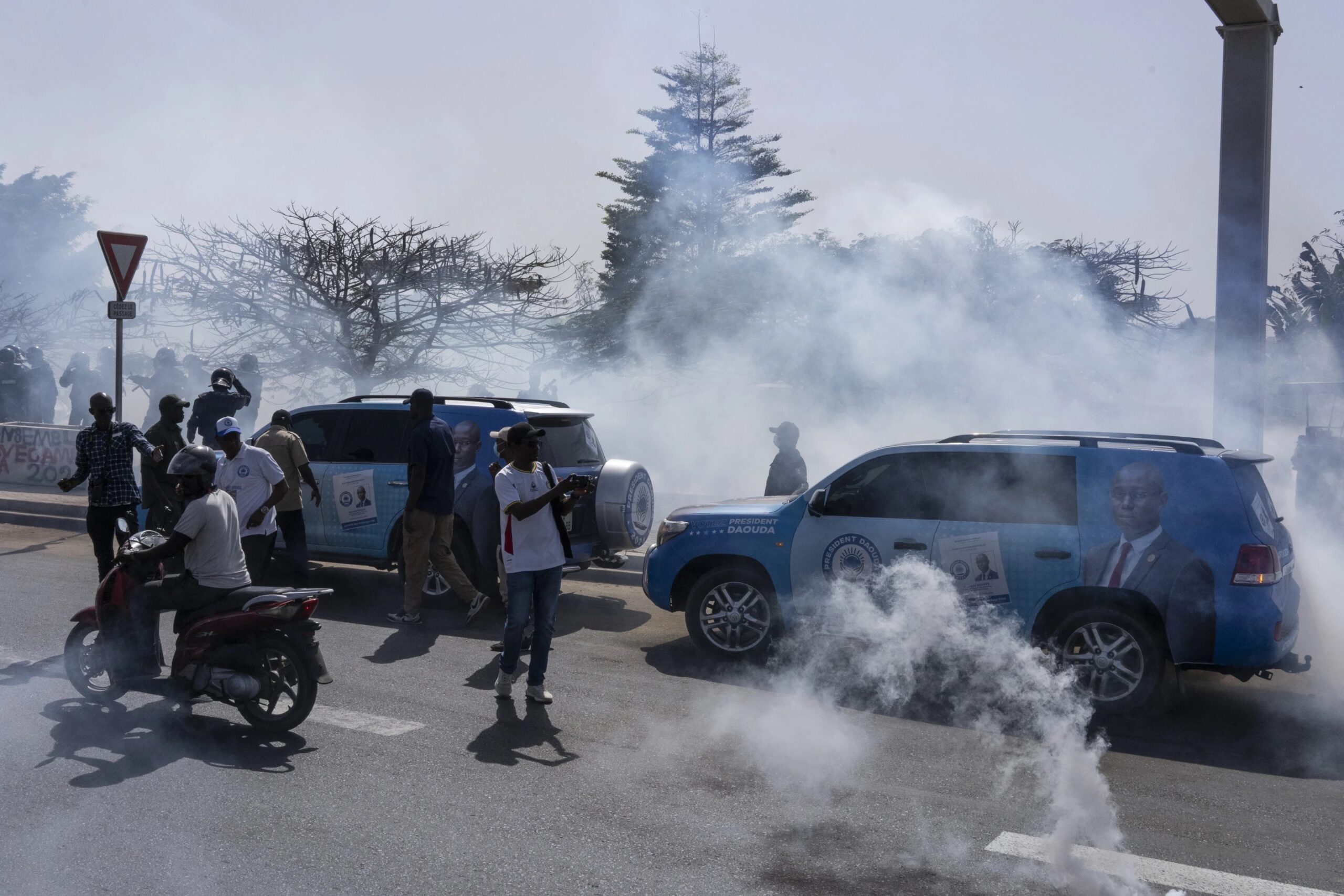 Senegalese riot police lobs tear gas at supporters of opposition presidential candidate Daouda Ndiaye in Dakar, Senegal, Sunday, Feb. 4, 2024. West Africa’s regional bloc on Sunday called for dialogue to resolve the political crisis in Senegal as opposition leaders rejected the decision by the country’s leader to postpone the Feb. 25 presidential election over an electoral dispute between parliament and the judiciary. (AP Photo/Stefan Kleinowitz)