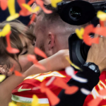 Kansas City Chiefs' Travis Kelce kisses Taylor Swift as they celebrate. REUTERS/Carlos Barria