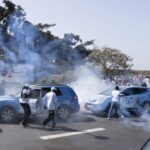 Senegalese riot police lobs tear gas at supporters of opposition presidential candidate Daouda Ndiaye, in Dakar, Senegal, Sunday, Feb. 4, 2024. West Africa’s regional bloc on Sunday called for dialogue to resolve the political crisis in Senegal as opposition leaders rejected the decision by the country’s leader to postpone the Feb. 25 presidential election over an electoral dispute between parliament and the judiciary. (AP Photo/Stefan Kleinowitz)