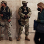 New York National Guard members stand guard inside Grand Central Station in New York City