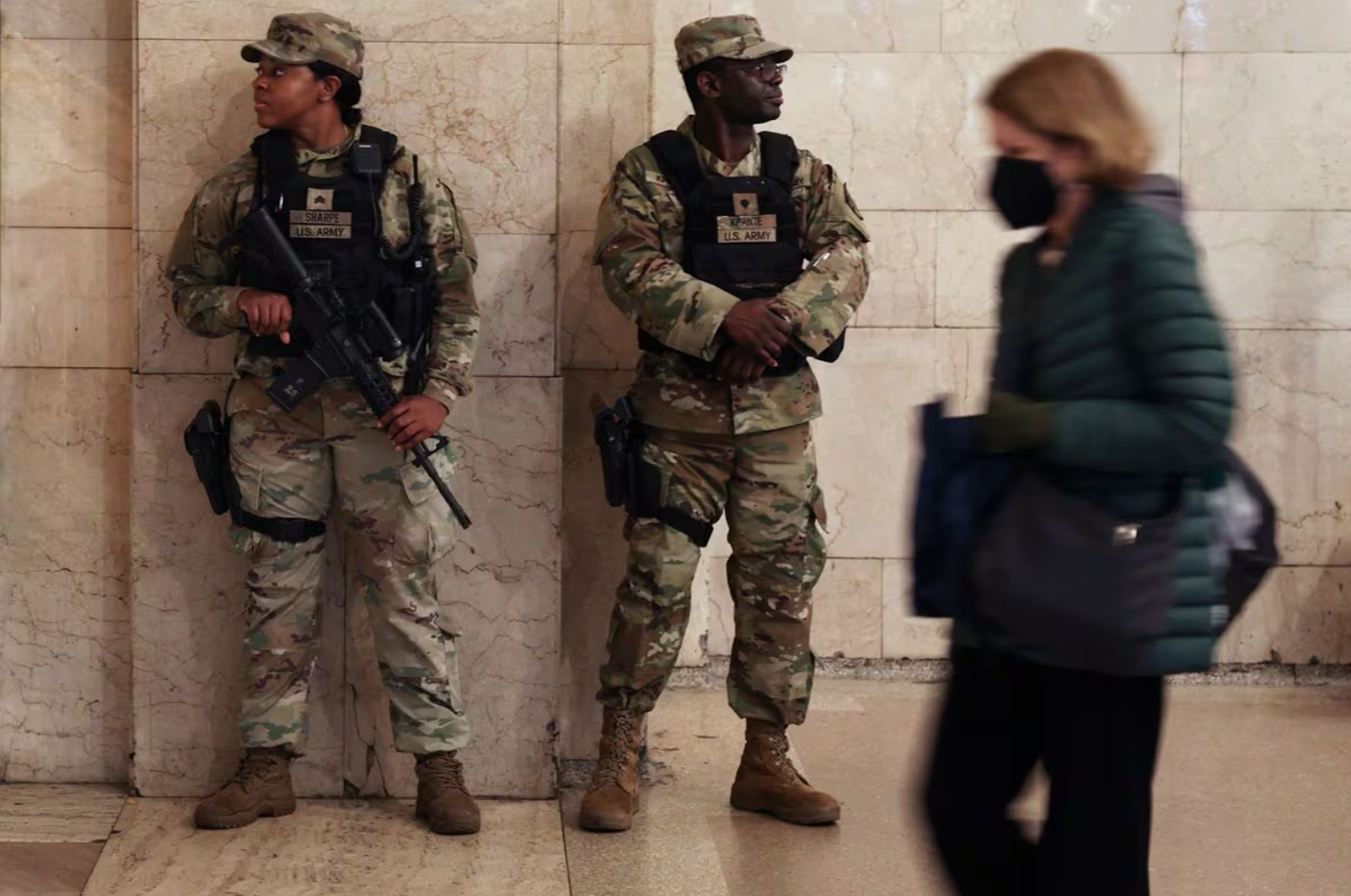 New York National Guard members stand guard inside Grand Central Station in New York City