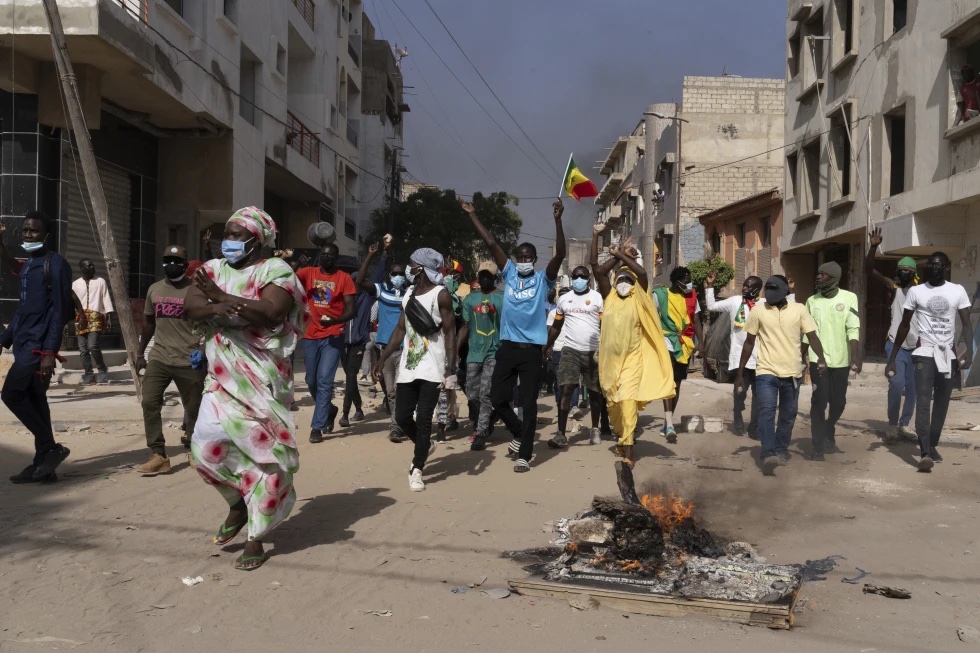 Demonstrators protest President Macky Sall’s decision to postpone the Feb. 25 vote