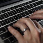 A person works on a laptop
