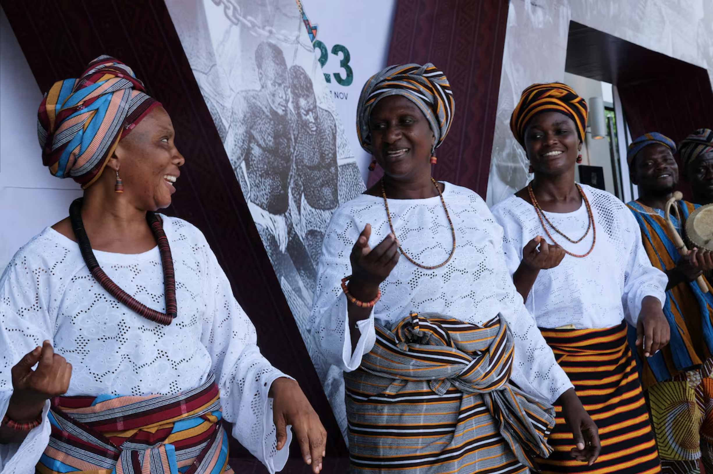 Women perform a traditional dance during the opening event of the African Union's conference on reparations in Accra
