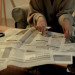 Woman searching job in newspaper