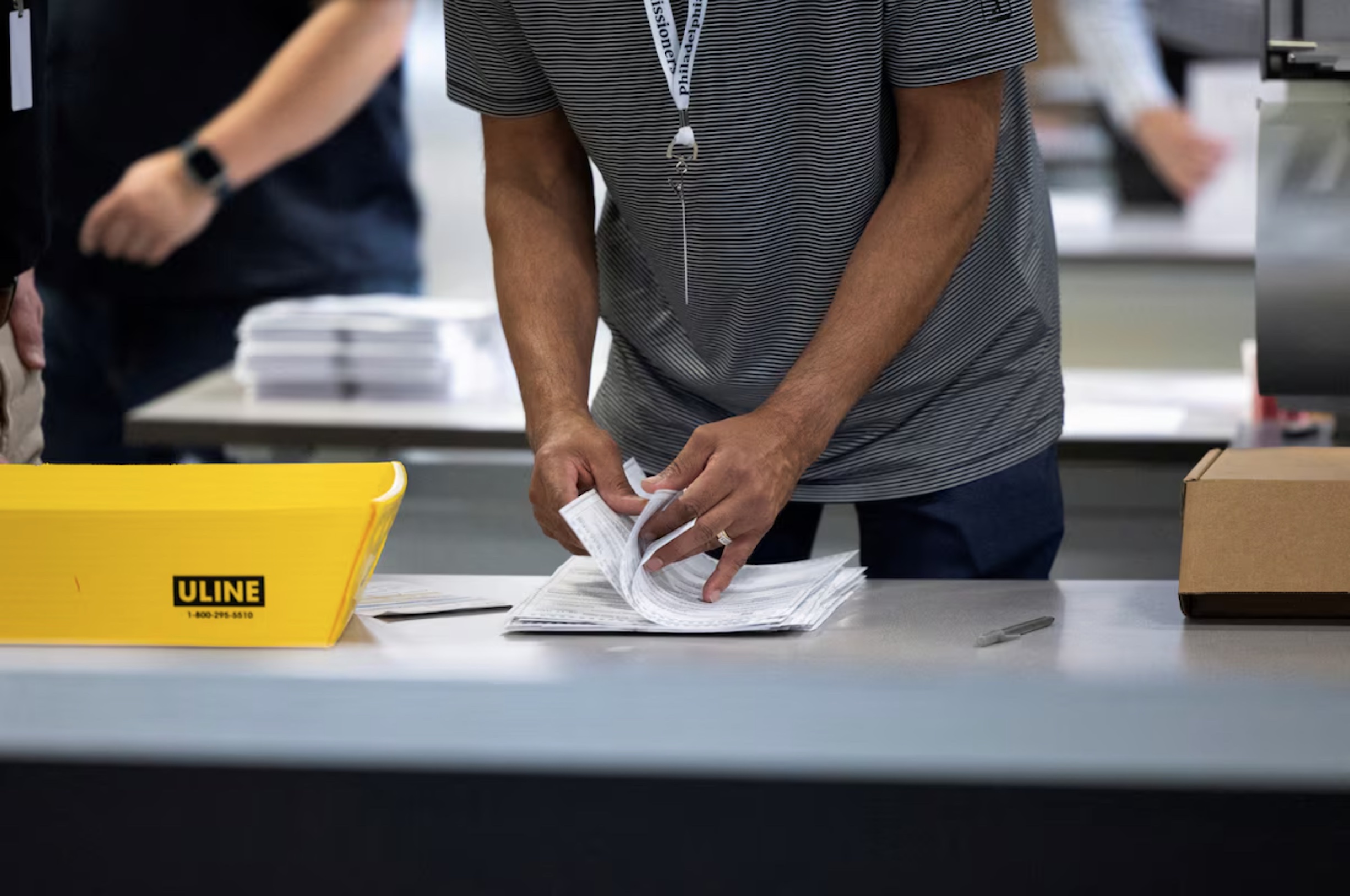An election worker processes ballots at Philadelphia's vote counting facility on Pennsylvania's primary election day in Philadelphia, Pennsylvania, U.S. April 23, 2024.