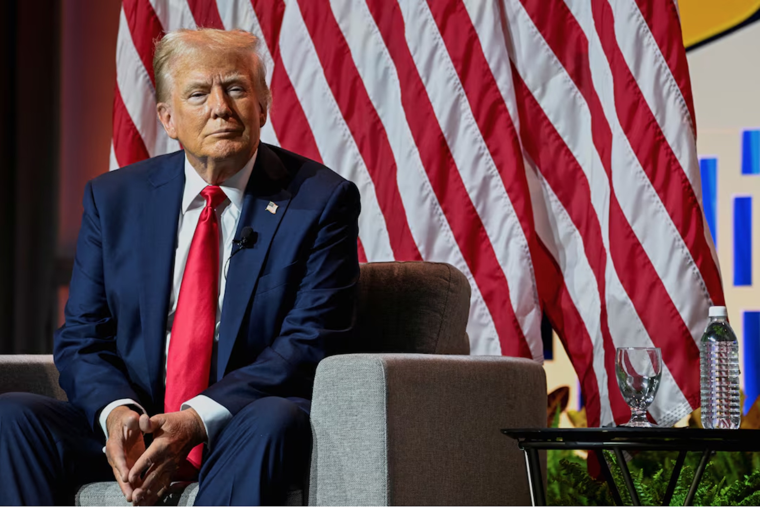 Republican presidential nominee and former U.S. President Donald Trump smiles while speaking on a panel of the National Association of Black Journalists (NABJ) convention in Chicago, Illinois, U.S. July 31, 2024.