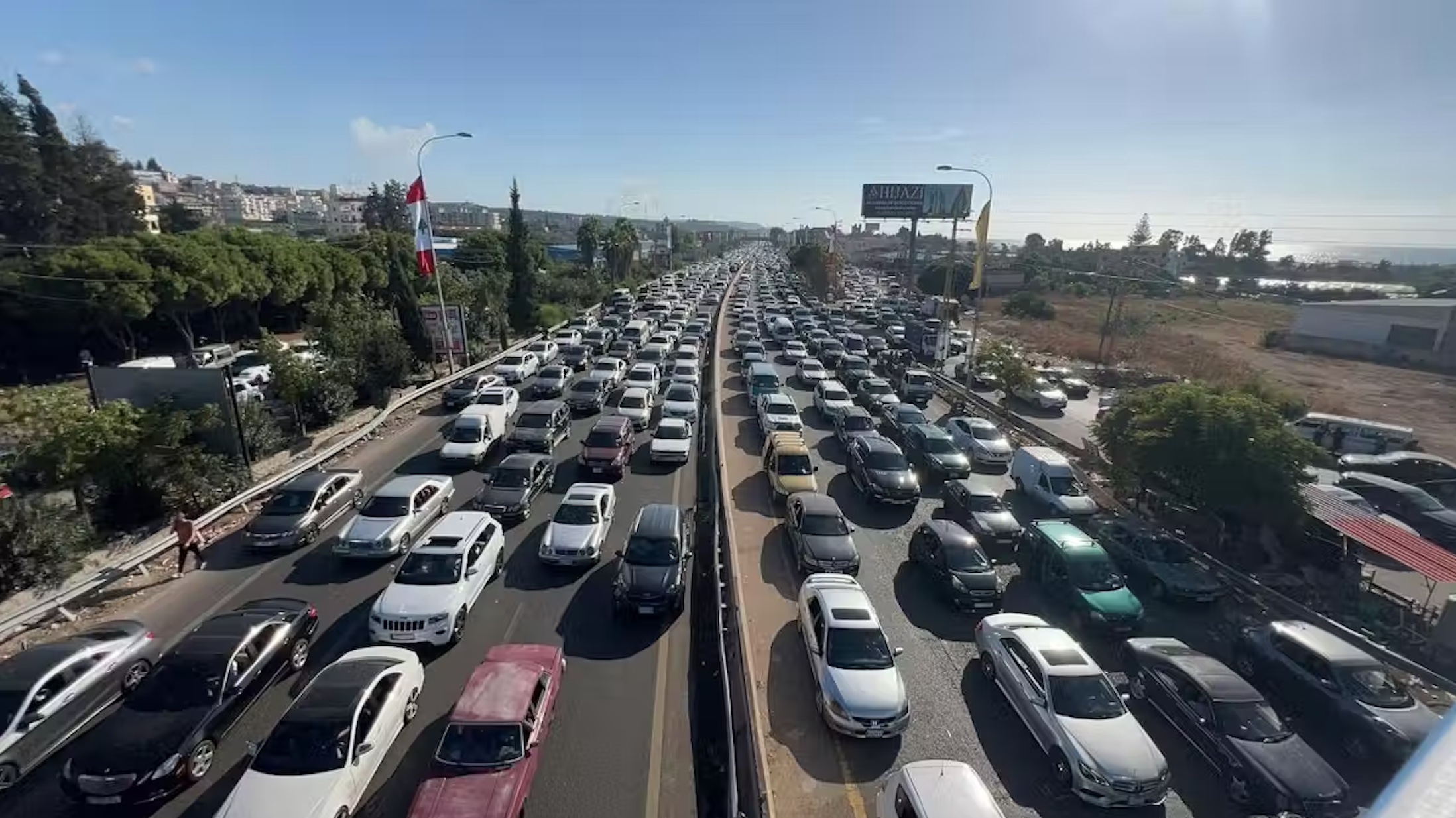Lebanese people fleeing in their cars from the fighting in southern Lebanon towards the north.